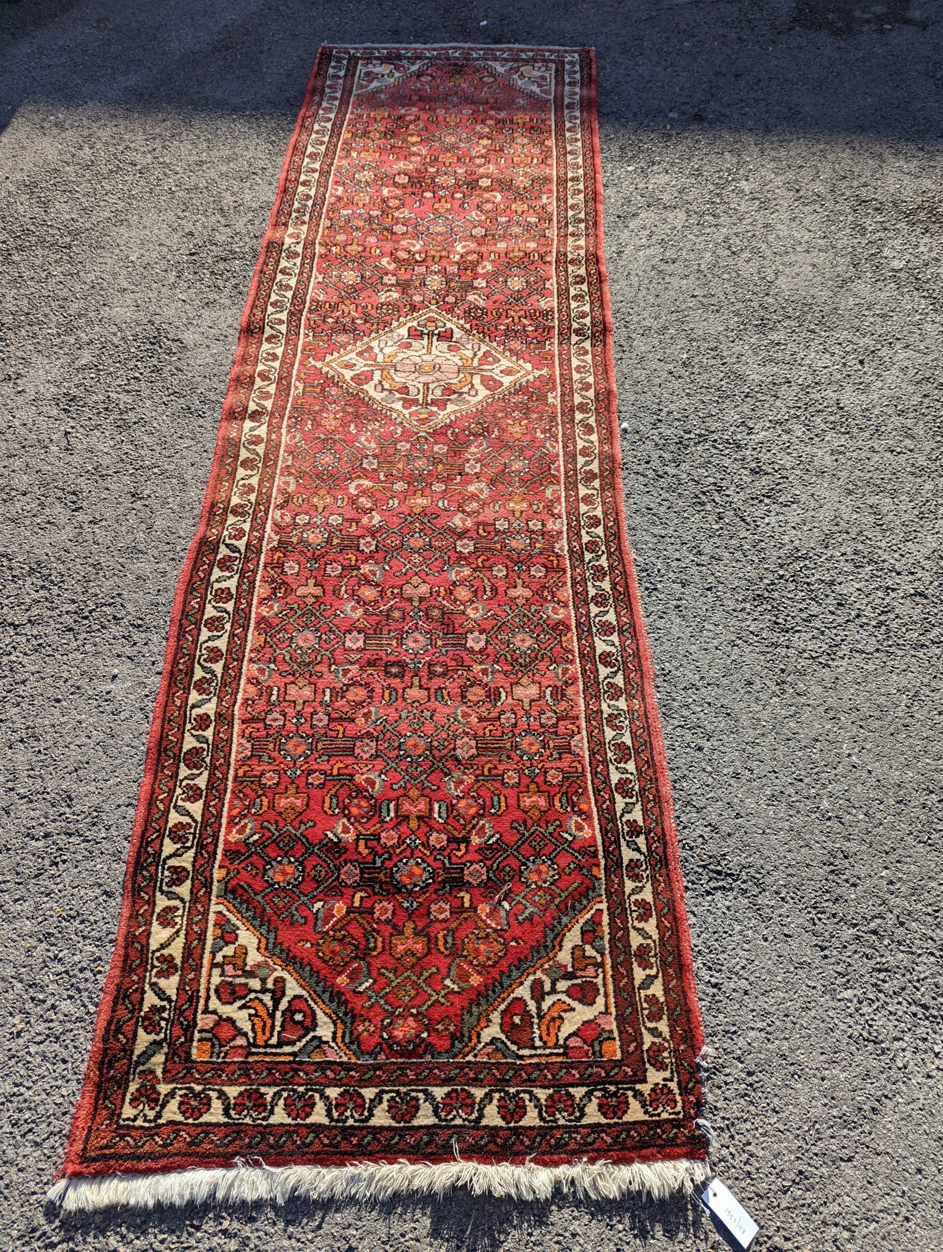A North West Persian red ground runner, 290 x 82cm